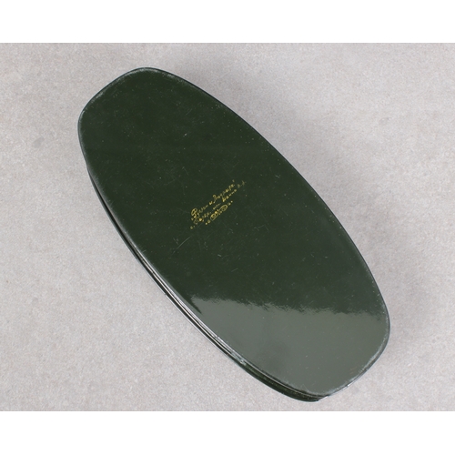 1042 - A mid to late 20th century Russian lacquered boxof elongated oval form, the hinged cover depicting a... 