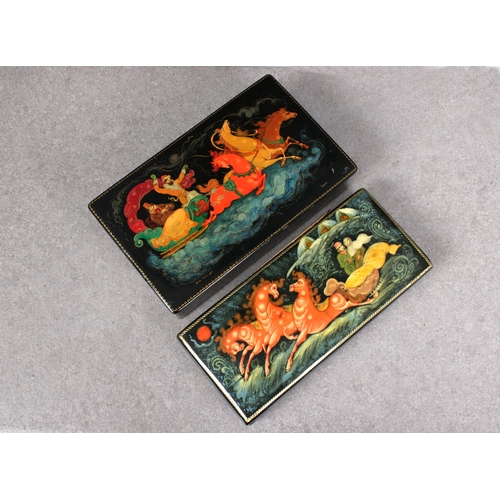 1055 - Two 20th century Russian Lacquered boxesof rectangular form, both with hinged covers, depicting troi... 