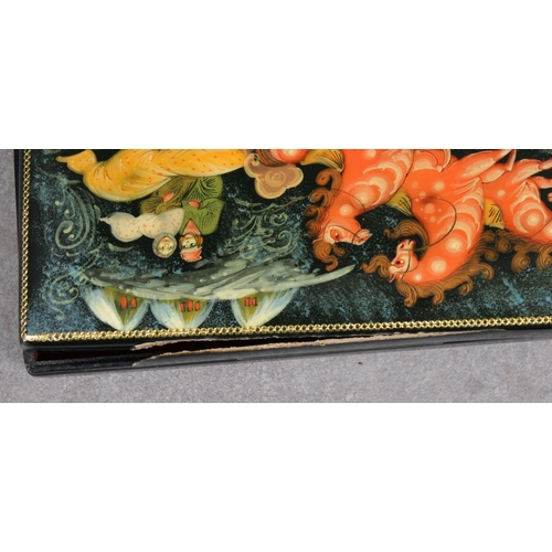 1055 - Two 20th century Russian Lacquered boxesof rectangular form, both with hinged covers, depicting troi... 