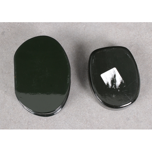 1058 - Two 20th century Russian Lacquered boxesof shaped oval forms, the hinged covers, depicting figures i... 