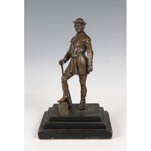 1091 - An Austrian Bronze Figure of a woodcutterunmarked, raised on wooden stepped square plinth, 20cm. hig... 