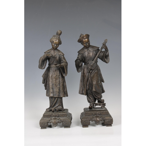 1099 - A pair of late 19th century European spelter figuresof a Chinese woman serving tea and a Chinese man... 