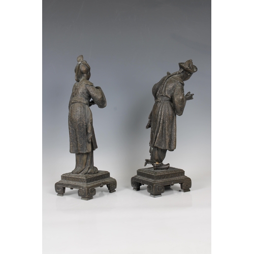 1099 - A pair of late 19th century European spelter figuresof a Chinese woman serving tea and a Chinese man... 