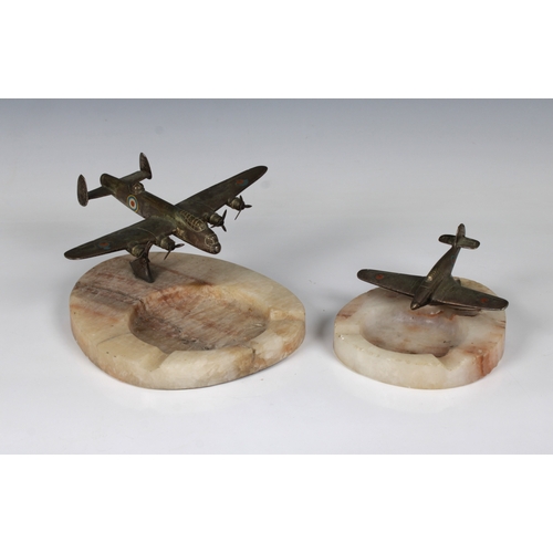 1104 - Two WWII Second World War mid-century desktop cast-metal models of an RAF Spitfire and Lancaster Bom... 