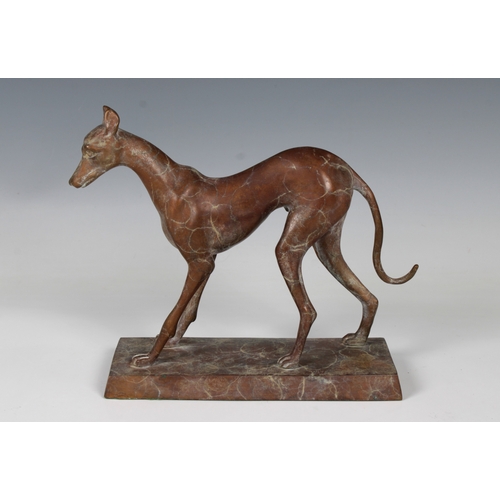 1106 - A 20th Century bronze statuette of a sight houndOn an integral plinth, 18.5cm high