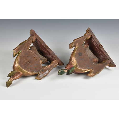 1109 - A pair of Venetian carved blackamoor wall brackets18th / 19th century, each figure dressed in parcel... 