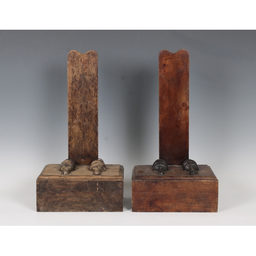 1110 - A pair of 19th century mahogany plate standsthe upright back supports set upon block plinths, having... 