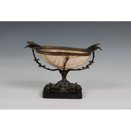 1117 - A late 19th century Nautilus shell bowl with gilt metal mounts in the form of a treewith snakes entw... 