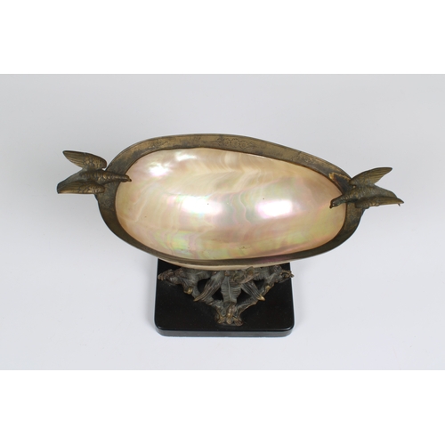 1117 - A late 19th century Nautilus shell bowl with gilt metal mounts in the form of a treewith snakes entw... 