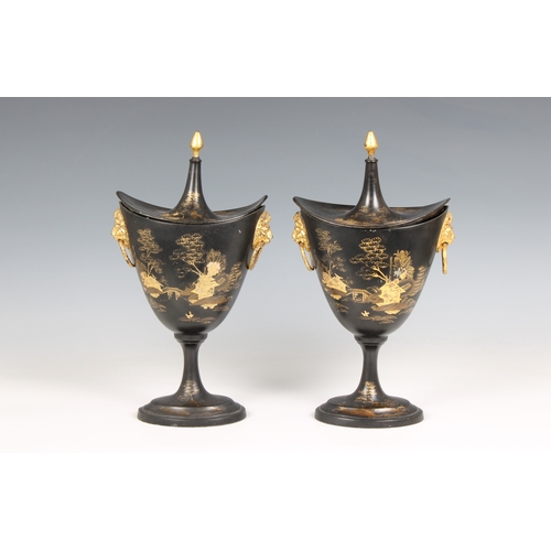 1118 - A pair of late 19th century, Regency style, black japanned and gilt tole and pewter chestnut urns wi... 