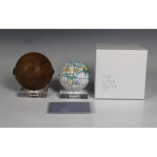 1129 - A miniature ceramic globe by Lorraine Rutt of The Little Globe Company, London,titled "Land and... 