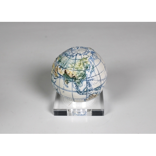 1129 - A miniature ceramic globe by Lorraine Rutt of The Little Globe Company, London,titled "Land and... 