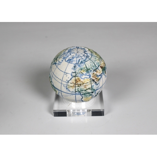 1129 - A miniature ceramic globe by Lorraine Rutt of The Little Globe Company, London,titled "Land and... 