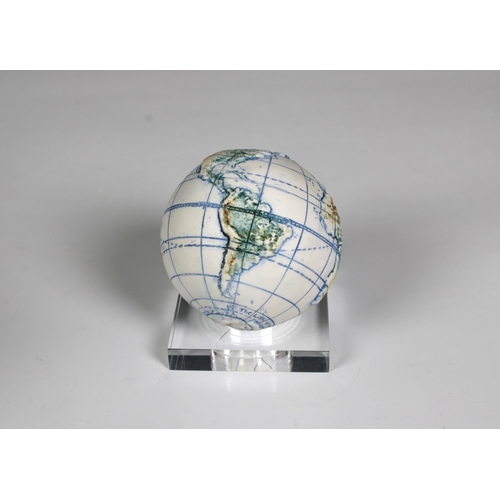 1129 - A miniature ceramic globe by Lorraine Rutt of The Little Globe Company, London,titled "Land and... 