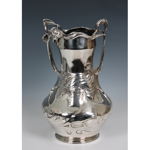 1162 - An Art Nouveau cast pewter vase, circa 1900, designed by J.R. Hannigdecorated with Irises and a maid... 