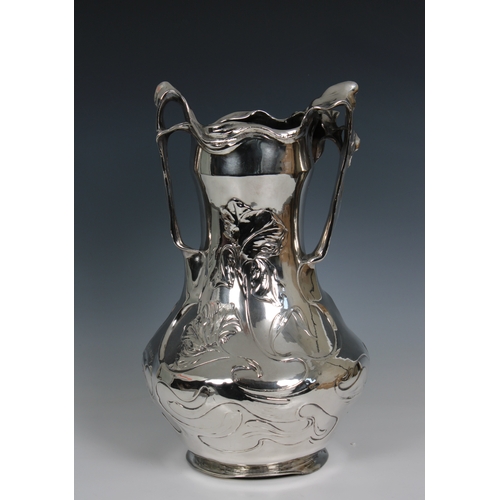 1162 - An Art Nouveau cast pewter vase, circa 1900, designed by J.R. Hannigdecorated with Irises and a maid... 