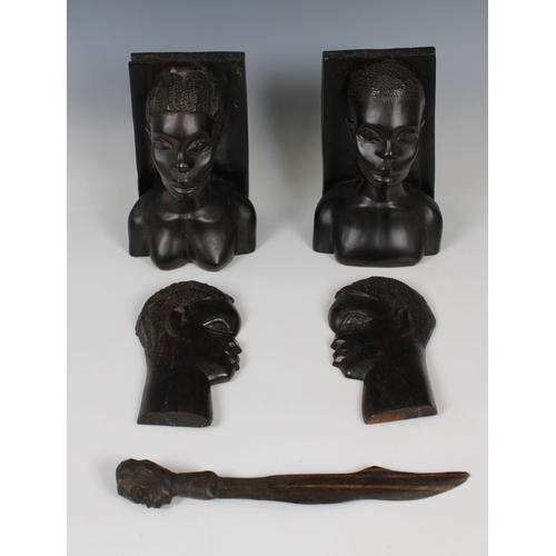 1171 - A small group of Ghanaian wooden carvingsto include a pair of bookends, a letter opener and a pair o... 