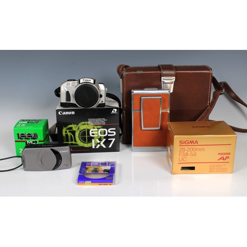 1179 - A cased Polaroid SX-20 Land Camera in leather casetogether with Canon EOS IX7; Sigma 28-200mm F3.8-5... 