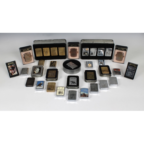 1182 - A collection of various Zippo lightersto include a tin boxed set of four 'Charlie Chaplin'; D. Day N... 