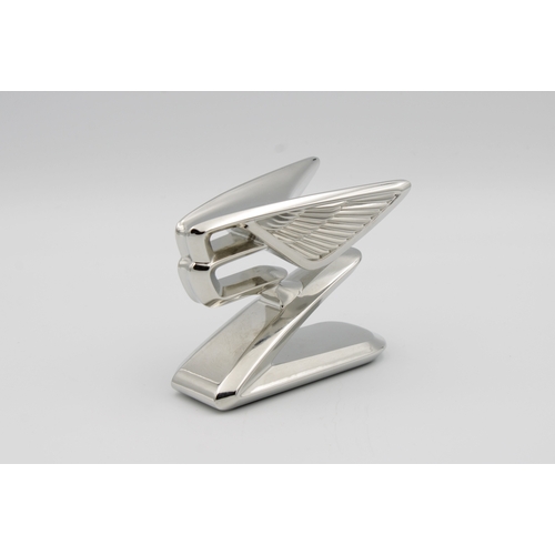 1069 - A chromium plated forward leaning double winged Bentley "B" car mascot6.5cm. high.