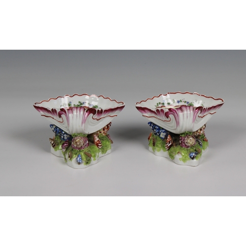 2003 - A pair of Bow porcelain sweetmeat stands circa 1765 in the form of upturned scallop shells, nestled ... 