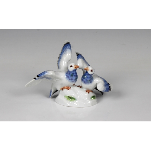 2046 - A late 20th century Meissen porcelain pair of pigeons, designed in 1892 by Emmerich Andresen (1843-1... 