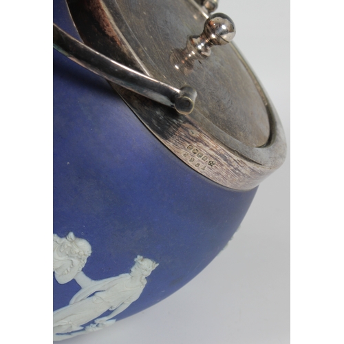 2056 - A Wedgwood blue and white jasper ware biscuit barrel with silver plated lid and handle, impressed fa... 