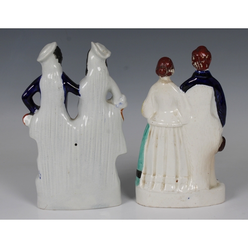 2078 - Two 19th century Staffordshire ceramic figures, each depicting a young couple, 19.5cm. high.