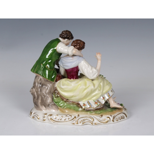 2084 - A 20th century Rudolf Kammer, Volkstedt, Germany, porcelain figure of a young couple, playing a pipe... 