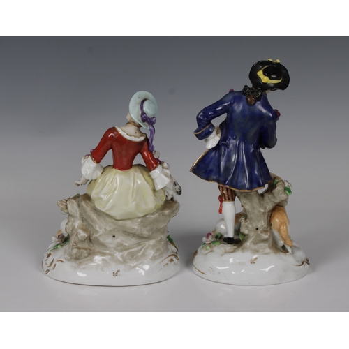 2097 - A pair of 20th century Dresden porcelain figures of an elegantly dressed couple, each with sheep, th... 