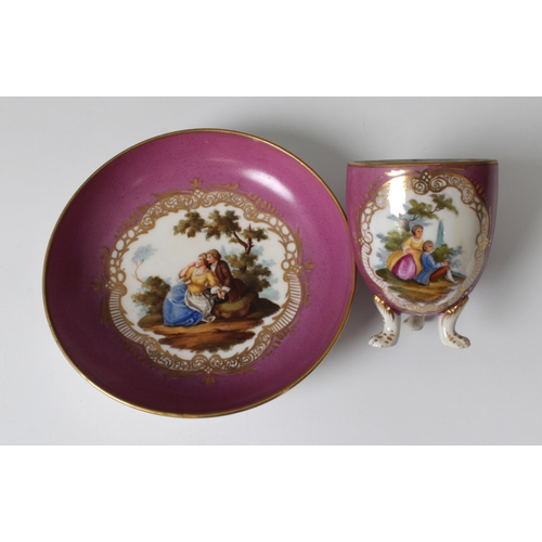 2106 - A late 19th century Carl Thieme, Dresden, chocolate cup & saucer, decorated with a country couple an... 