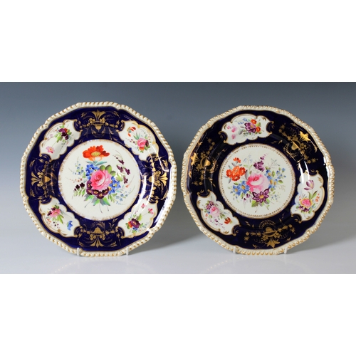 2114 - Two early 19th century Crown Derby plates with blue borders, and polychrome floral and gilded decora... 