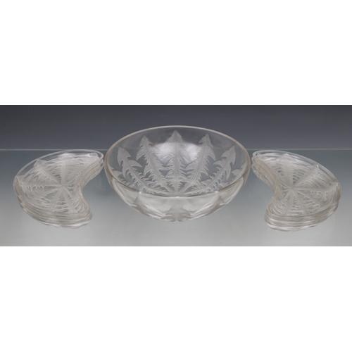 2127 - A Lalique moulded clear glass Pissenlit (Dandelion) salad bowl and six side dishes, Mid 20th century... 