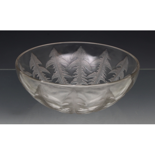 2127 - A Lalique moulded clear glass Pissenlit (Dandelion) salad bowl and six side dishes, Mid 20th century... 