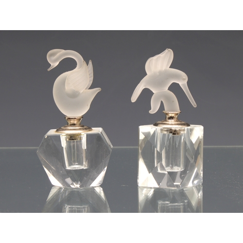 2132 - Two cut glass scent bottles with frosted bird stoppers, to include a swan & humming bird, the talles... 