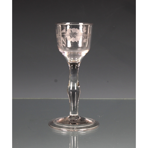 2135 - A mid-18th century engraved wine glass, c.1750, the ogee bowl wheel engraved with a rose and floral ... 