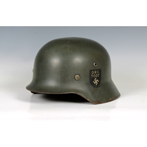 2151 - A German Organisation Todt single decal steel combat helmet, faint stamped marks, possible ET64 & lo... 