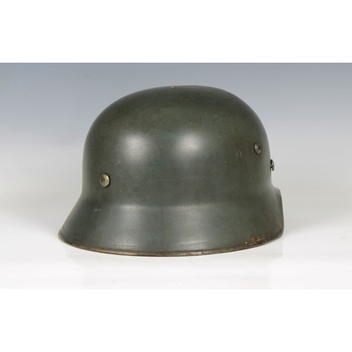 2151 - A German Organisation Todt single decal steel combat helmet, faint stamped marks, possible ET64 & lo... 