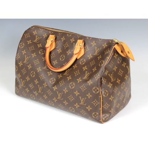 2228 - Louis Vuitton 'Speedy' monogram handbag, rolled and stitched leather top handles, internal zipped po... 