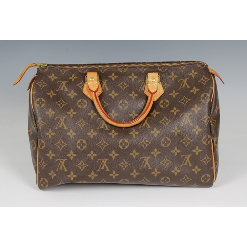 2228 - Louis Vuitton 'Speedy' monogram handbag, rolled and stitched leather top handles, internal zipped po... 