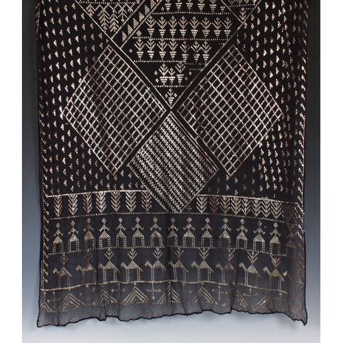 2242 - Egyptian Assuit silver and black net shawl, with overall silver appliqu? diamond, figural and foliat... 