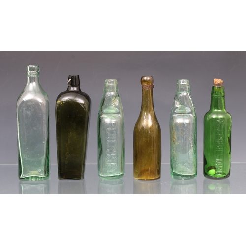 2258 - A collection of vintage / antique bottles, to include a green glass gin bottle of rectangular form w... 