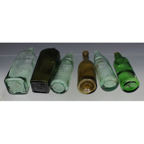 2258 - A collection of vintage / antique bottles, to include a green glass gin bottle of rectangular form w... 