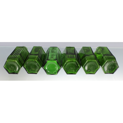 2260 - A set of six green hexagonal poison bottles, on marked 'NOT TO BE TAKEN', each having three ribbed s... 