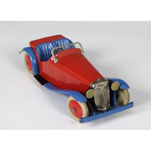 2360 - Meccano clockwork tinplate Two-Seater Sports Car, with red body and hubs and blue wheel arches, bump... 