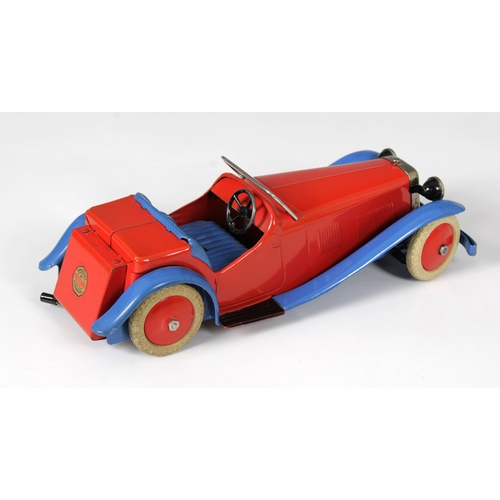 2360 - Meccano clockwork tinplate Two-Seater Sports Car, with red body and hubs and blue wheel arches, bump... 