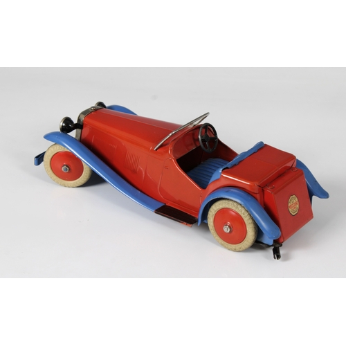 2360 - Meccano clockwork tinplate Two-Seater Sports Car, with red body and hubs and blue wheel arches, bump... 