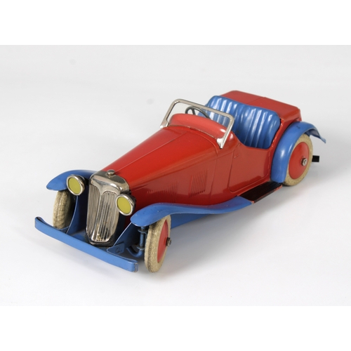 2360 - Meccano clockwork tinplate Two-Seater Sports Car, with red body and hubs and blue wheel arches, bump... 