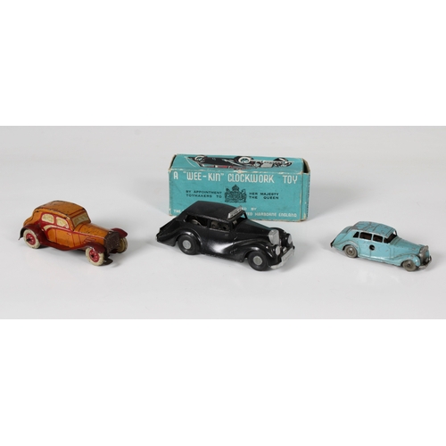 2458 - Three Mechanical Clockwork toy cars - To include a boxed Chad Valley Wee-Kin Police car, together wi... 