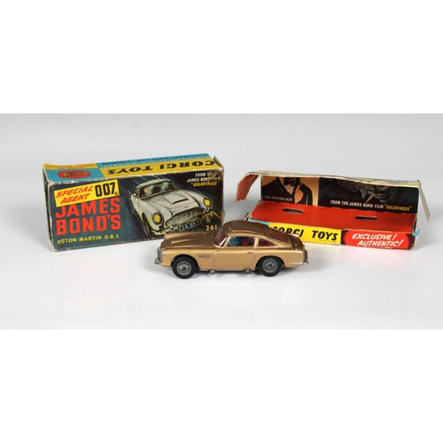 2502 - Corgi Toys 261 James Bond's 007 Aston Martin D.B.5, with figures, good playworn condition, inner dis... 